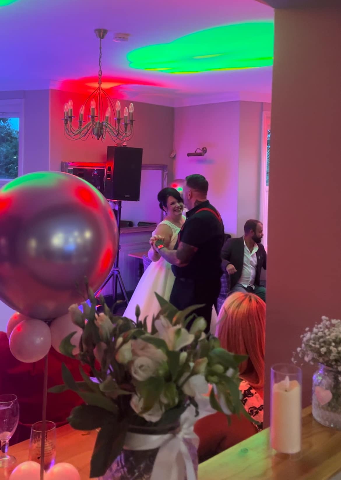 The Lower Bell Inn - Decorated for a wedding event - Bride and Groom laughing and dancing on the dance floor