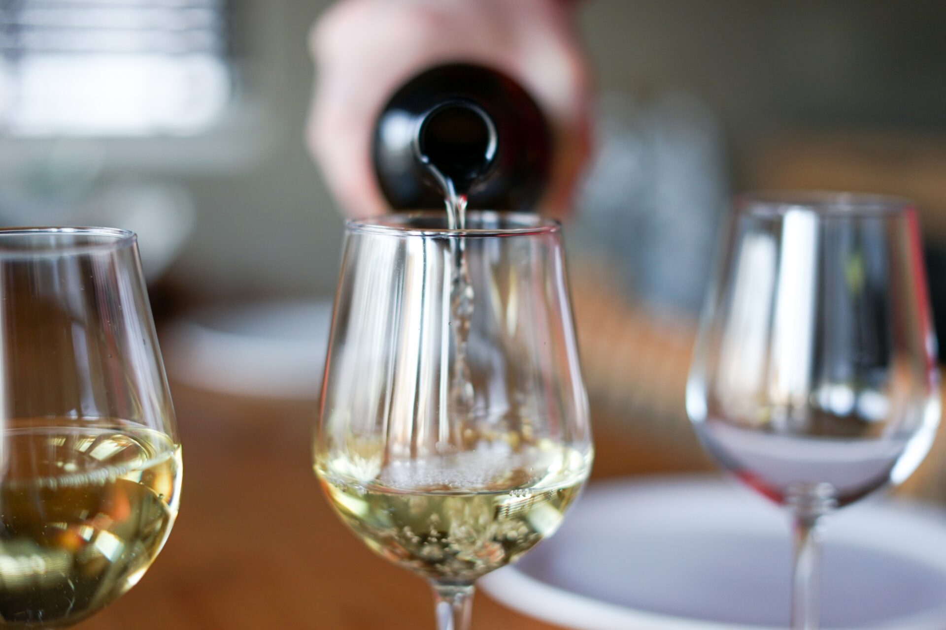 White Wine being poured into a glass - The Lower Bell Inn